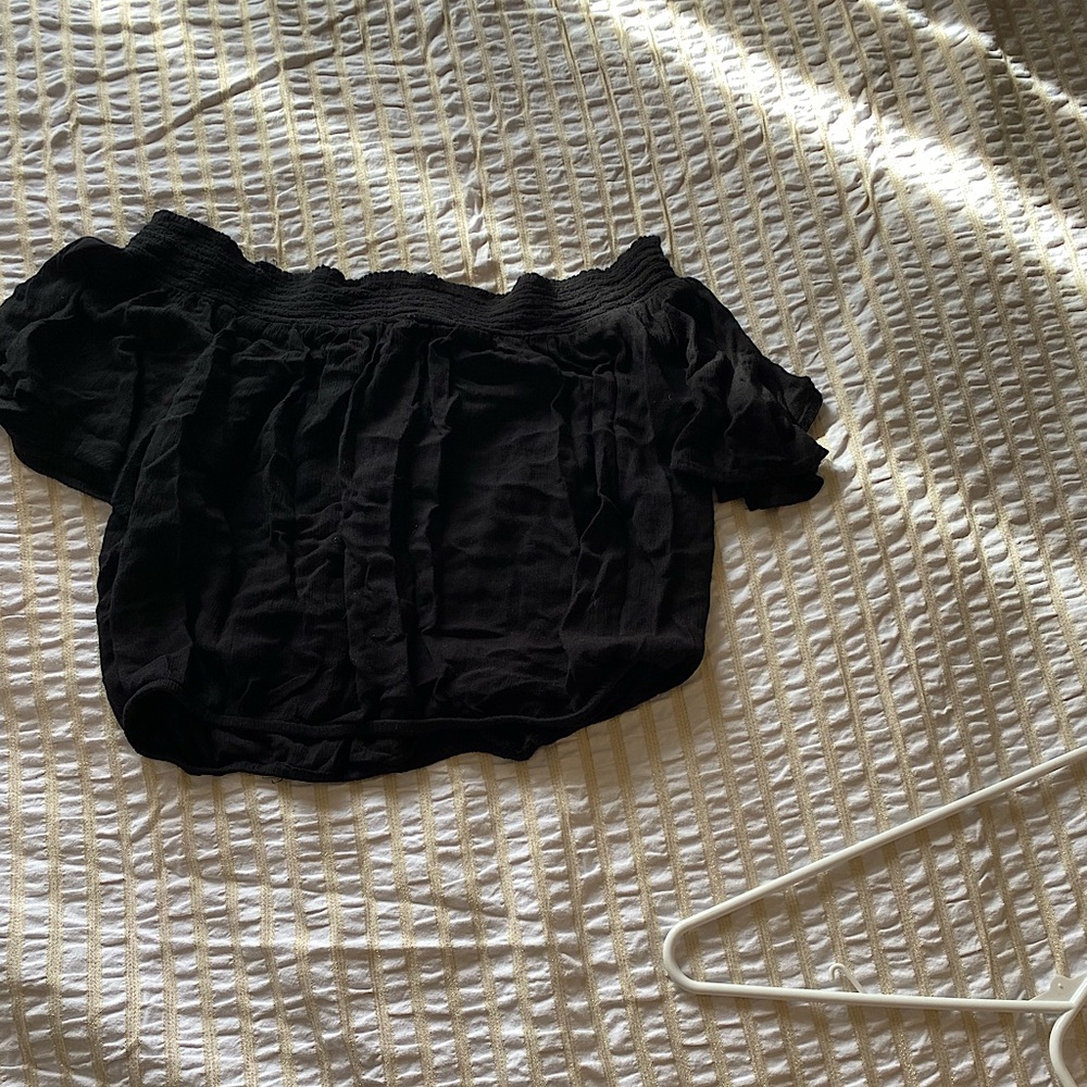 I am selling this off the shoulder, flowery, black cropped shirt/tank